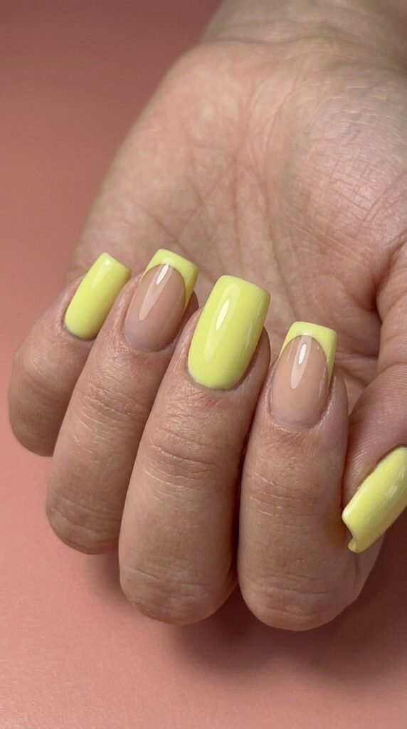 Citrus lemon yellow French gel nails with gold metallic outline – summer gel nail ideas square