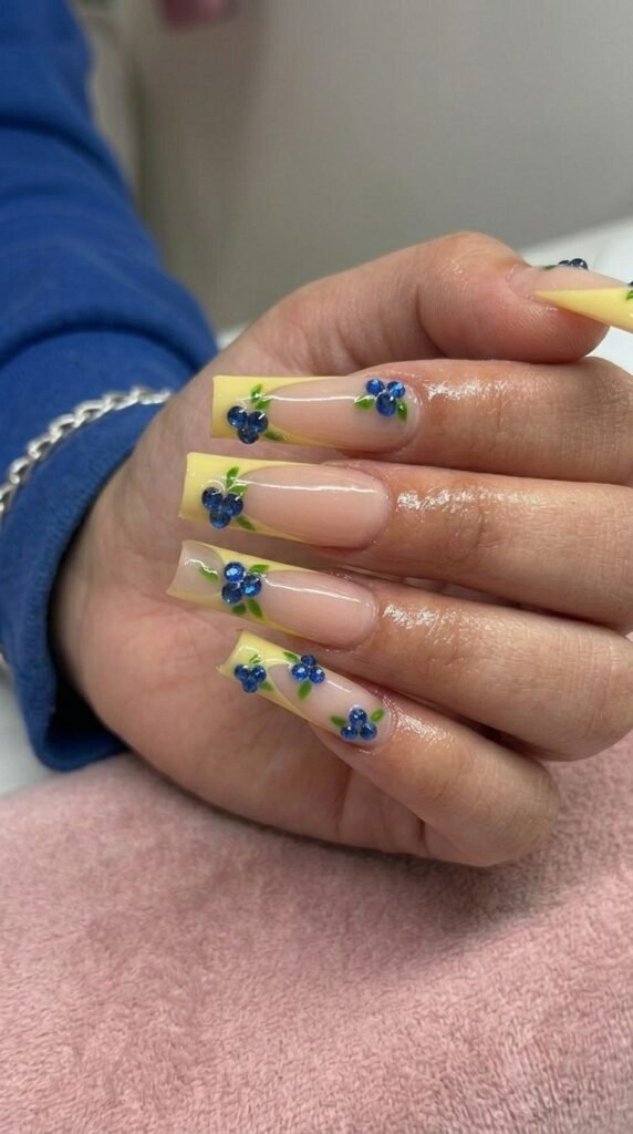 Lemon yellow French tip coffin nails with 3D blueberry art for summer 2026
