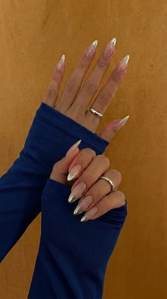 Metallic silver chrome ombre nails for fall nail trends 2026 with festive shine finish