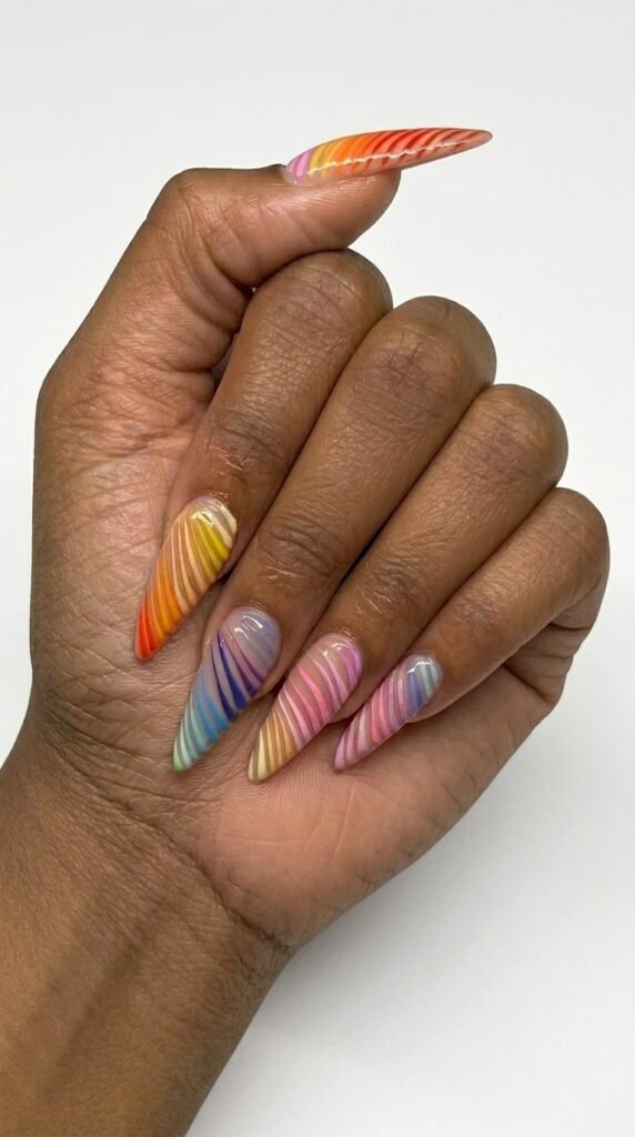 Multi-color rainbow swirl stripe extra long stiletto gel nails – bold chic summer gel nail ideas